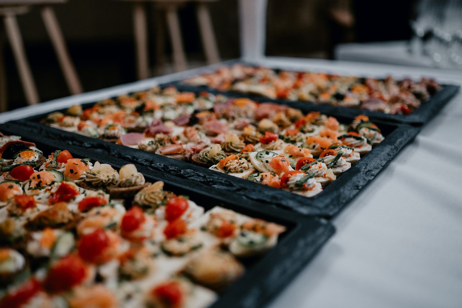 Three slates with canapes on. Photo thanks to Matt Fox Photography.