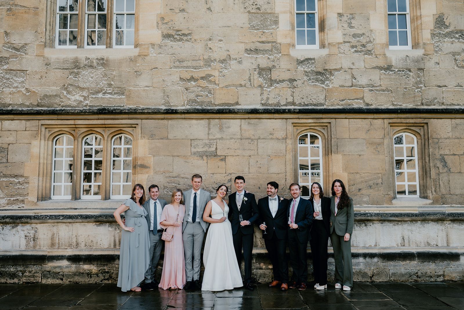 Adrianna and James stood in front of Wadham College with friends for a formal photo. Photo courtesy of Matt Fox Photography.