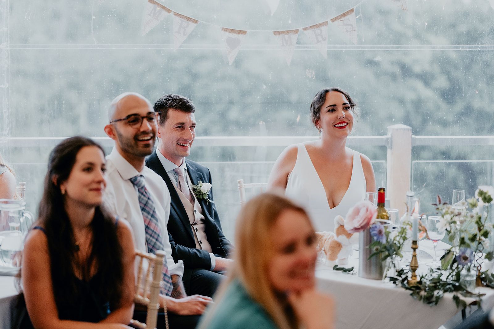 Adrianna and James watch the video as part of their wedding speeches. Photo courtesy of Matt Fox Photography.