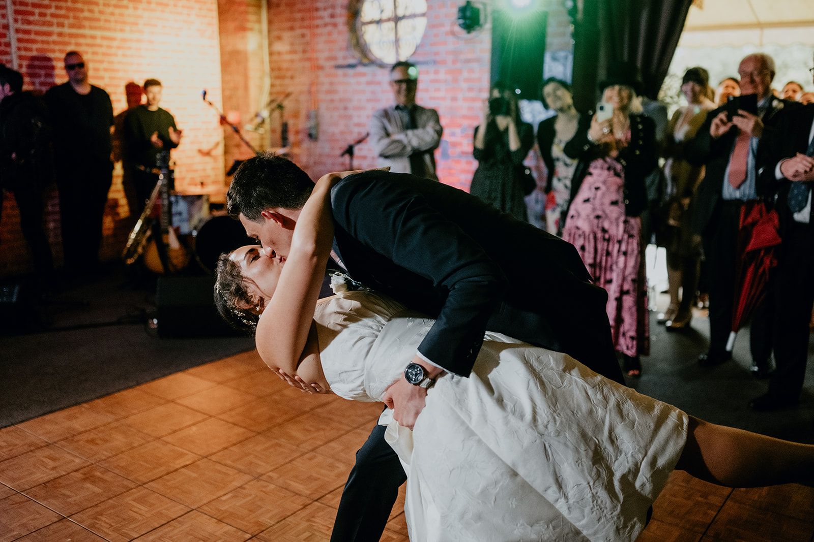 James and Adrianna kiss and lean down during their first dance at Cherwell Boathouse. Photo courtesy of Matt Fox Photography.